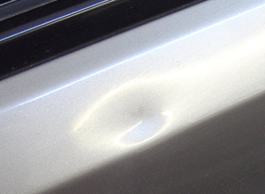Paintless Dent Removal (PDR) car dent repair